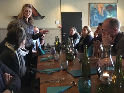 Workshop participants in conversation with the owner of Siglunes Guesthouse in Siglufjördur about tourism entrepreneurship in an isolated region