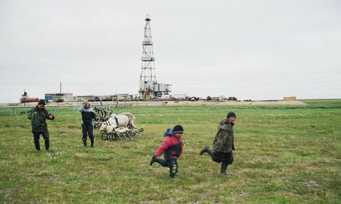 Stammler - Children from camp 2 playing on a pasture close to an oil rig on the Toravei deposit Nenets AO Barents Region Russia