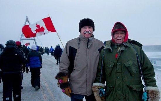 Dennis Bevington (MP, Western Arctic) with Elder Sam Elleze at the opening of the Deh Cho Bridge over the Mackenzie River near Fort Providence, Northwest Territories, Canada