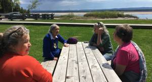 Meeting with Elder Jean Crane in Happy Valley, Goose Bay spring 2022. From left: Rauna Triumf, Jean Crane, Sylvia Moore, Elisabeth Utsi Gaup. Photo: Marikaisa Laiti