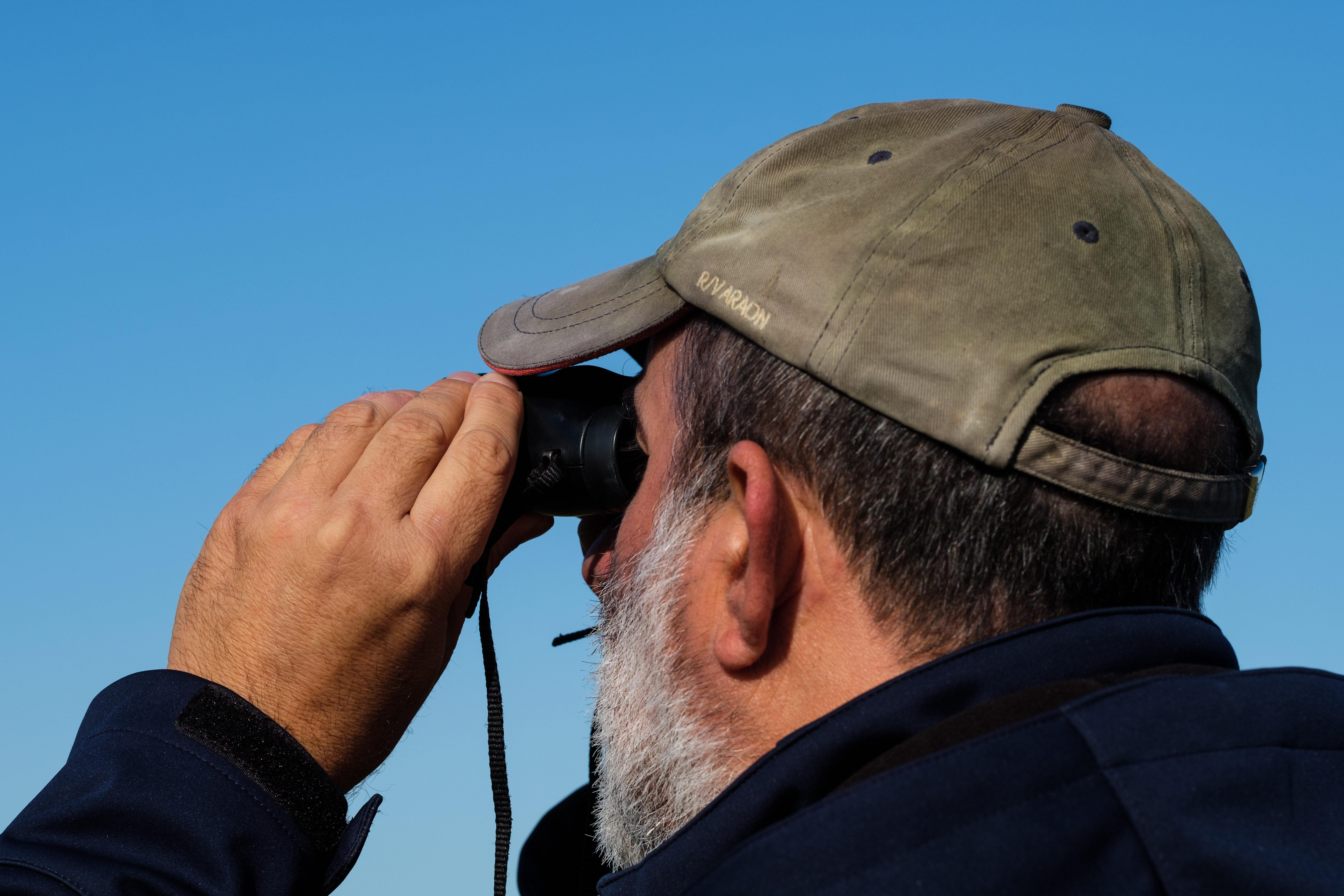 Man With Binoculars PHOTO: Weronika Murray