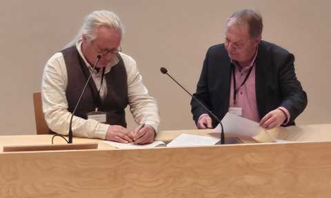 Lars Kullerud, the UArctic President and Markku Heikillä, the Head of Science Communications of the Arctic Centre, University of Lapland in the signing event